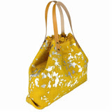 Stylish gold and white canvas handbag with leather handles, handcrafted in Italy.