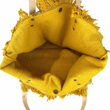Stylish yellow canvas handbag with leather handles, handcrafted in Italy, showcasing a gorgeous bohemian design.