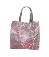 Side view of python embossed handbag, green and pink