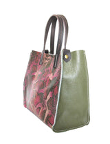 Side view of python embossed handbag, vibrant colors