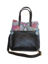 Back view of floral python print handbag, detachable purse.
