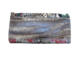 Bottom view of python print handbag, unique leather texture.