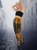 Unisex boho patchwork pants with a relaxed fit and drawstring waist. Handmade from soft cotton, perfect for casual and eco-friendly fashion.