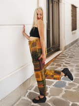 Handmade boho cotton patchwork pants in vibrant orange tones. Ethically crafted with a relaxed fit, ideal for hippie and artistic fashion lovers.