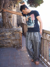 a man standing on a bridge pointing at something