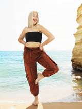 Red hippie yoga pants with ocean cliff background
