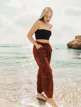 Red cotton yoga pants walking on beach