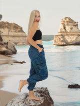 Blue handmade boho cotton yoga pants on beach