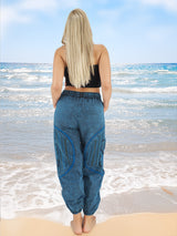Back view of blue boho yoga pants at beach