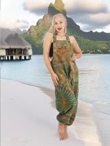 a woman standing on a beach next to a body of water