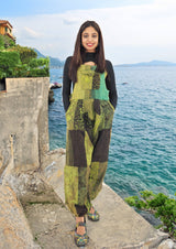 a woman standing on a rock next to the ocean