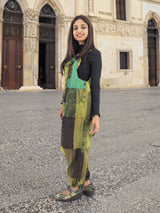 a woman standing in front of a large building
