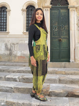 a woman standing on steps in front of a building