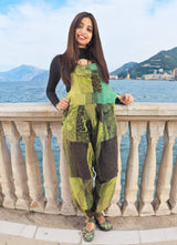 a woman standing on a balcony next to a body of water