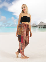 a woman standing on top of a sandy beach