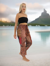 a woman standing on a beach next to a body of water