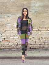 a woman standing in front of a brick wall