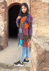 a young girl standing in a doorway of a building