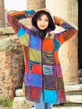 a woman in a colorful jacket posing for a picture