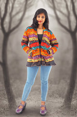 a woman standing in the middle of a forest