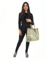Elegant Bohemian Tote Bag with Gold Floral Print, Handmade in Italy, Paired with Stylish Black Outfit