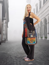 Handmade cross body cotton hemp hippie handbag purse with vibrant embroidery and stonewash finish, worn by a model in a stylish urban setting.