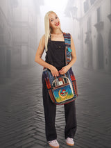 Handmade hippie handbag with a unique cotton hemp design, worn cross body by a model in a misty alleyway. Perfect for school, travel, or casual outings.