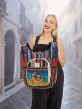 Front view of a handmade cotton hemp hippie handbag with a colorful moon and mushroom embroidery, held by a smiling model in a European-style street.