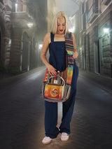 Boho-style handmade cotton hemp cross body bag with colorful tribal patterns, showcased by a model in a nighttime urban setting.