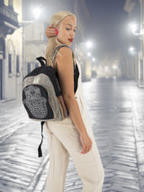 Handmade cotton hemp backpack with intricate embroidery, worn by a model in a stylish urban setting. Ideal for school, travel, and casual outings.