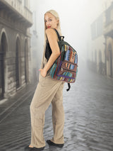Bohemian-style handmade cotton hemp backpack with intricate embroidery, showcased by a model in a misty European alley. Perfect for students and travelers.