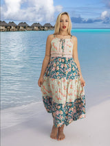 a woman standing on a beach next to the ocean