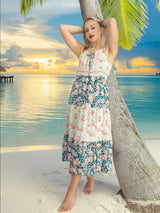 a woman standing on a beach next to a palm tree