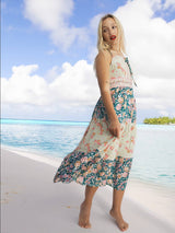 a woman standing on a beach next to the ocean