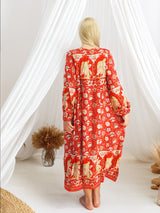 a woman standing in front of a white curtain