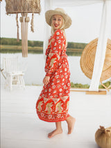 a woman in a red dress and a straw hat