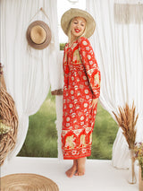 a woman in a red dress and hat standing in front of a window