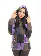 a woman wearing a jacket with a hoodie on