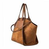 Side view of brown leather and suede handbag