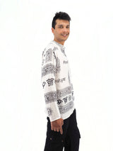 a man in a white shirt and black pants