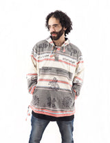 a man with a beard wearing a striped hoodie