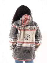 a woman wearing a jacket with a hood