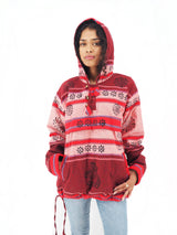 a woman wearing a red and pink hoodie