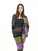 a woman in a black top and purple pants