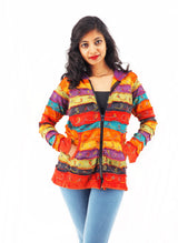 a woman in a colorful jacket posing for a picture