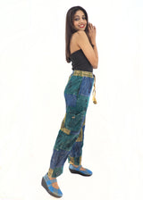 a woman in a black top and blue pants