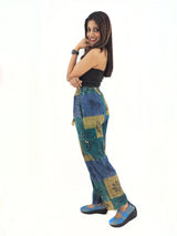a woman in a black top and blue pants