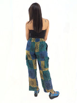 a woman in a black top and blue pants