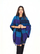 Yak Wool Shawl Throw in vibrant blue and purple tones, wrapped around shoulders. Handmade, warm, and ideal for layering or meditation.
