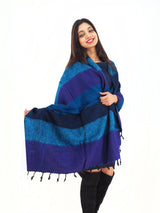 Soft and warm Yak Wool Shawl Throw in blue and purple, worn stylishly. Handmade and multi-functional, great as a blanket or meditation shawl.